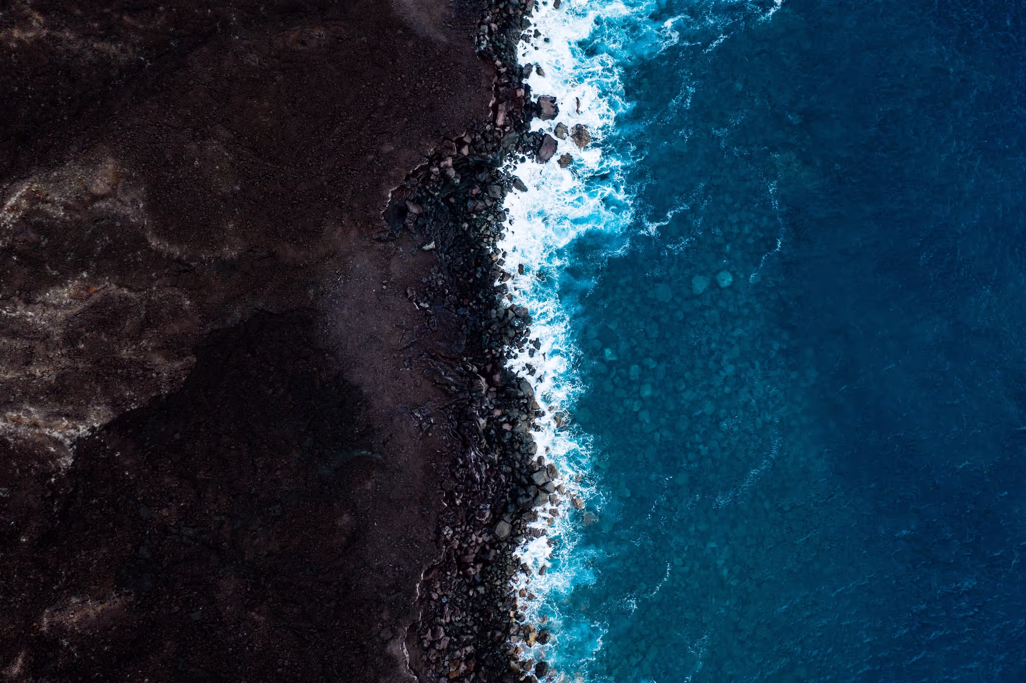 Ocean waves meeting a rugged coastline